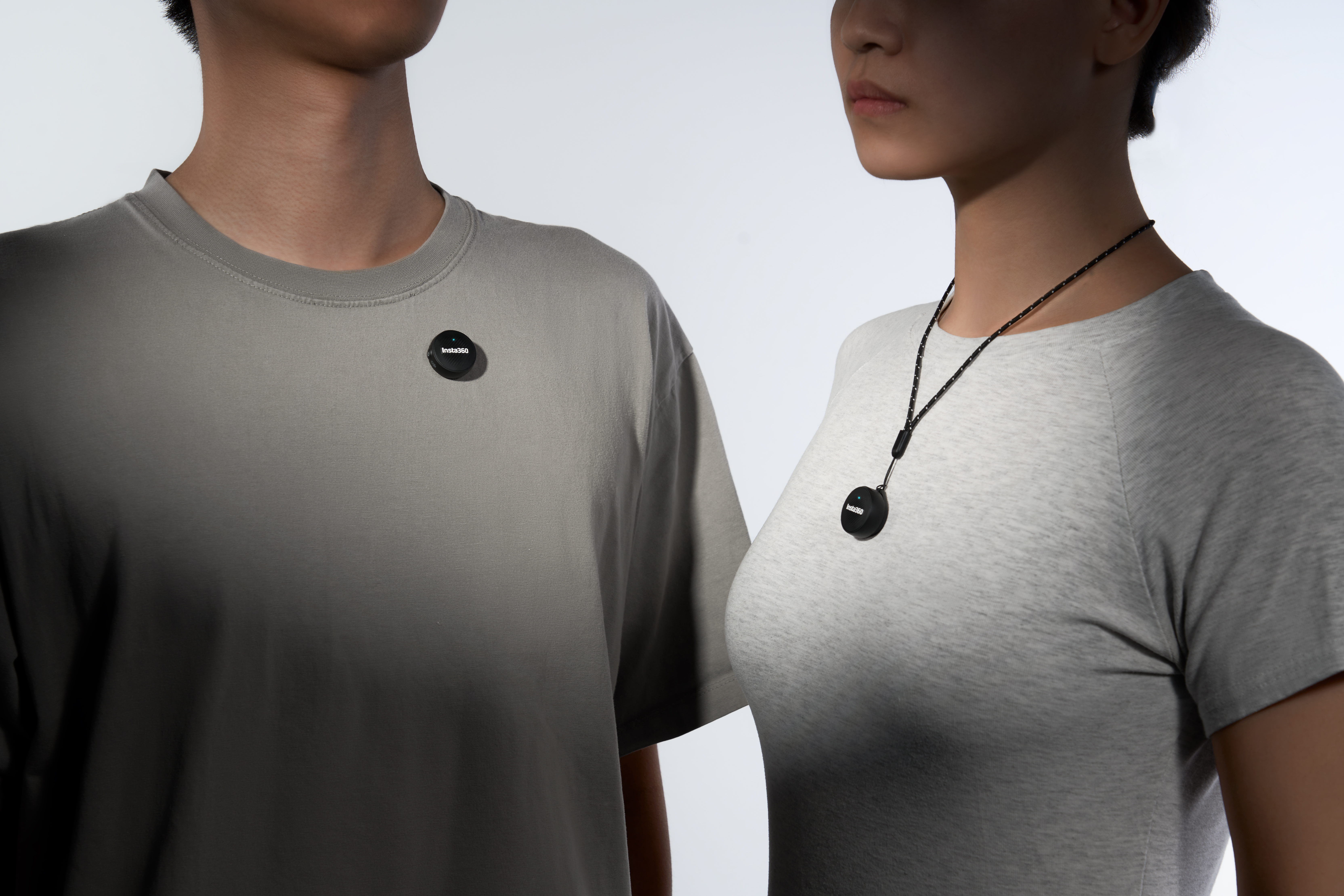 Two people wearing Insta360 Mic Air wireless microphones in different fashions. One on a magnetic pendant and one on a strap.
